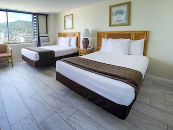 Minibar, desk, iron/ironing board, bed sheets at Waikiki Monarch Hotel