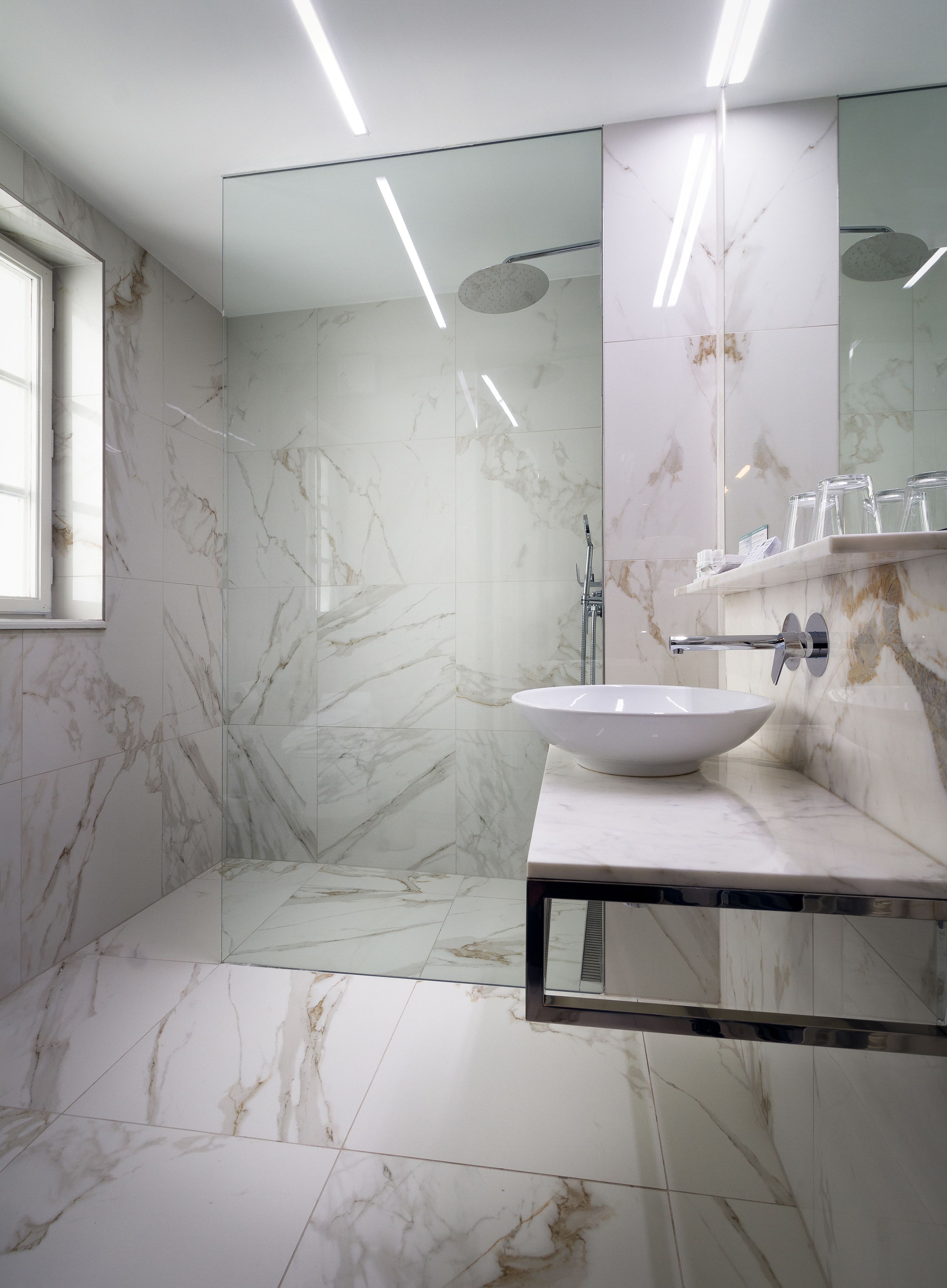 standard double room | bathroom | designer toiletries, hair dryer, towels