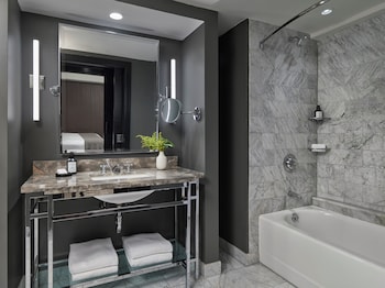 Suite, 1 Bedroom | Bathroom | Combined shower/tub, eco-friendly toiletries, hair dryer, bathrobes at Hotel AKA Boston Common
