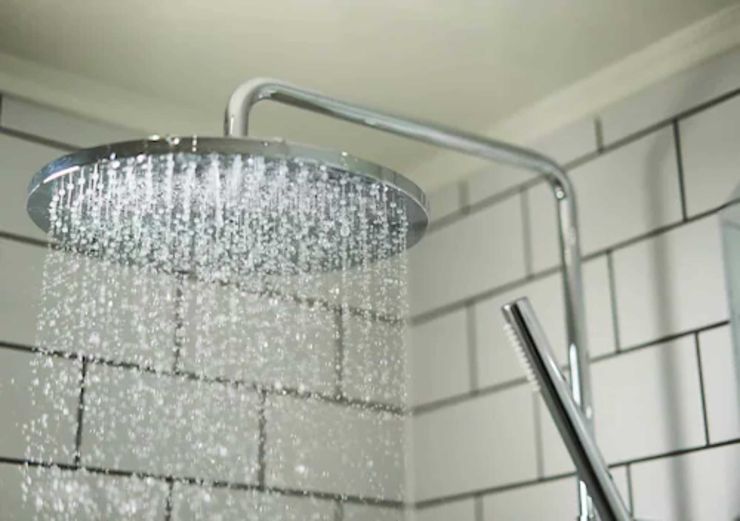 A showerhead with water running.