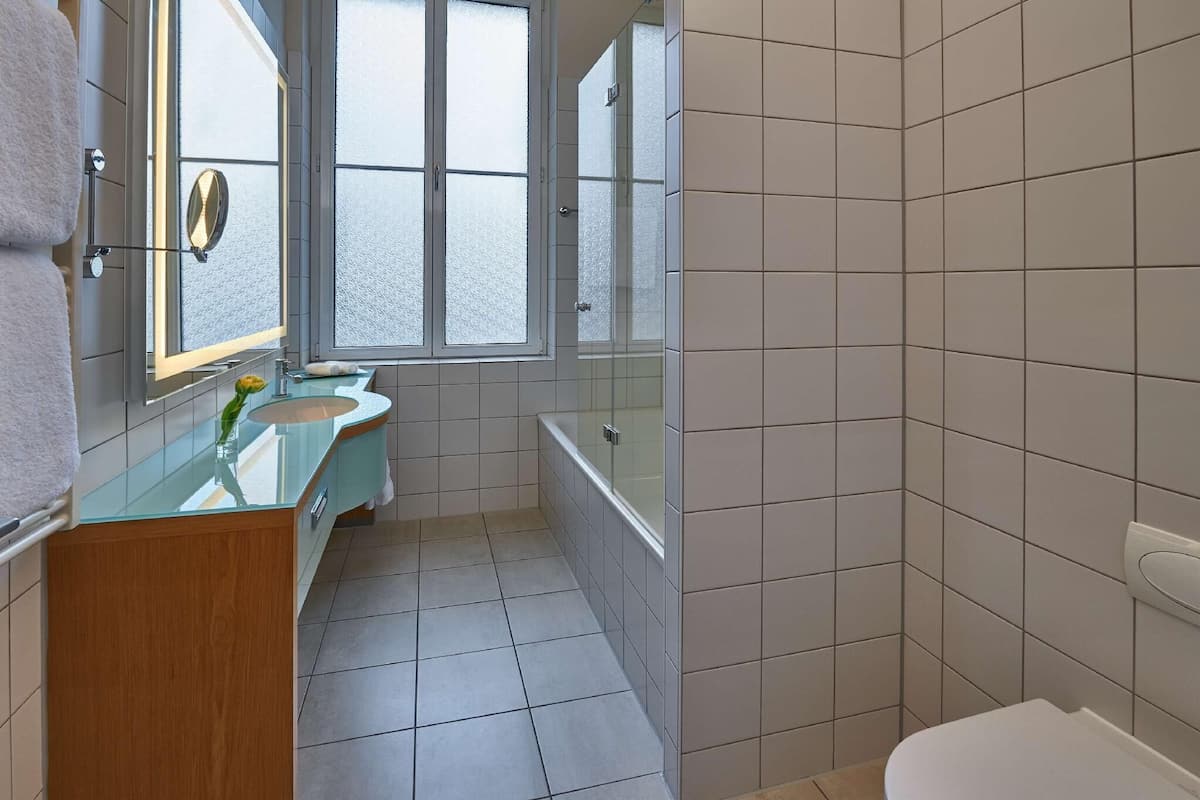 Bathroom | Shower, designer toiletries, hair dryer, slippers