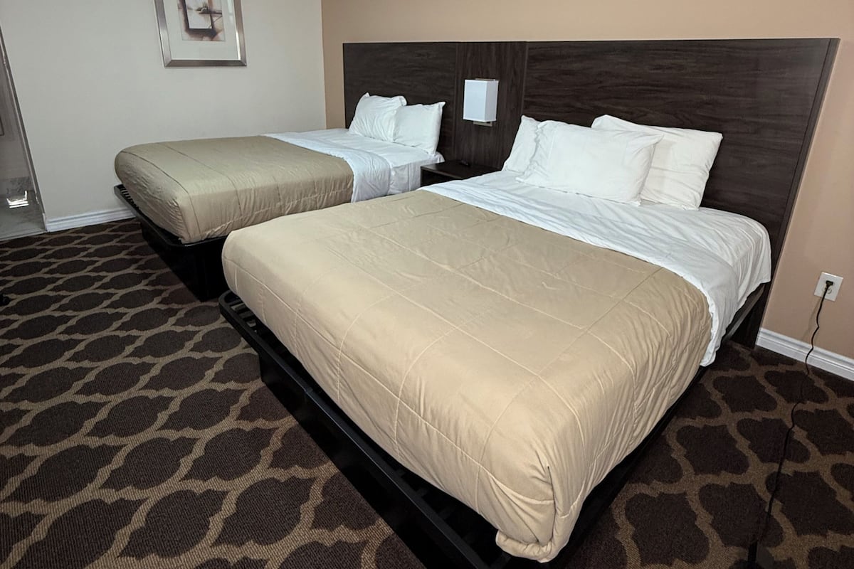 Room, 2 Queen Beds, Non Smoking | Desk, iron/ironing board, free cots/infant beds, rollaway beds