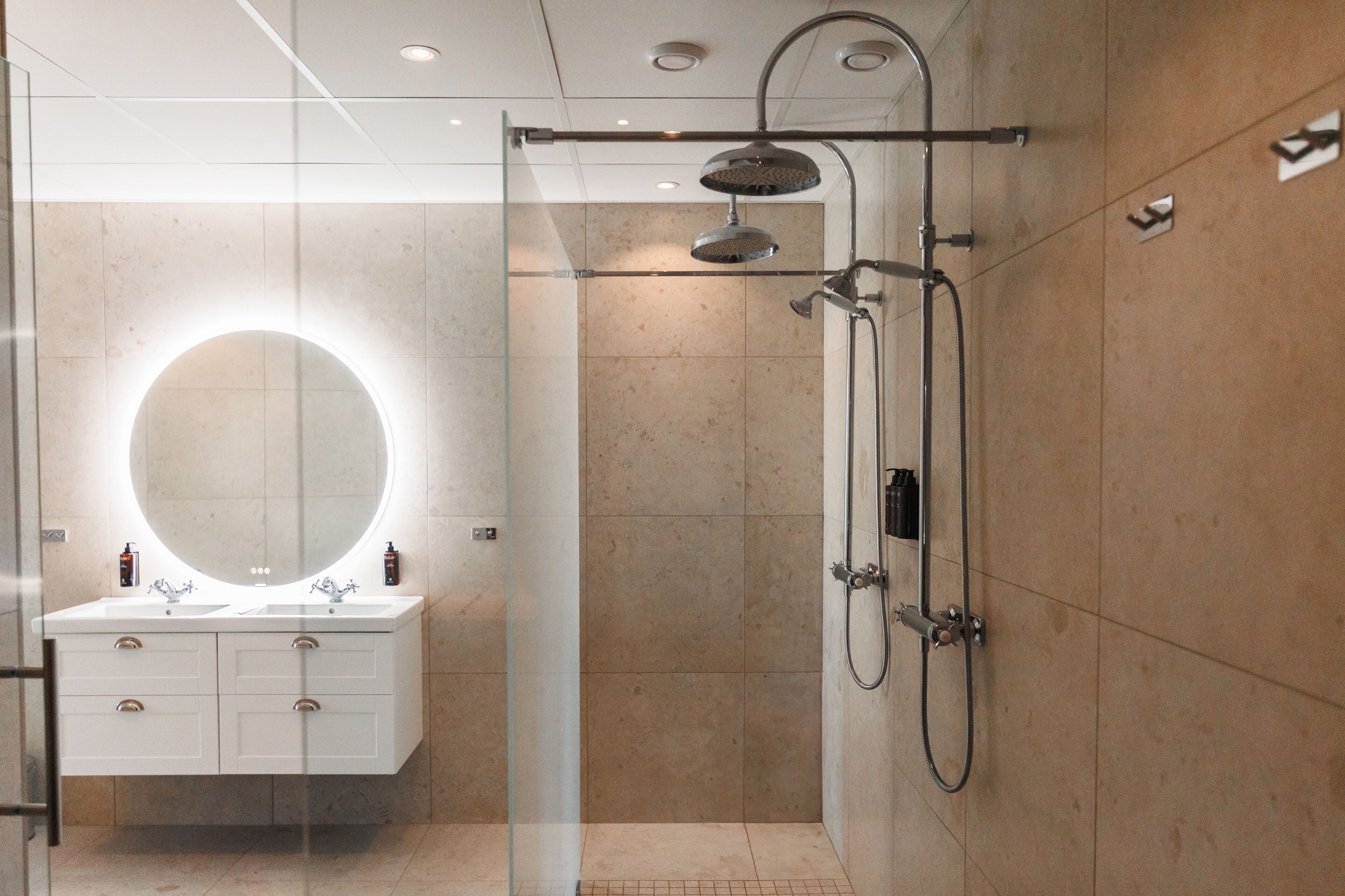 suite | bathroom | shower, hair dryer, towels