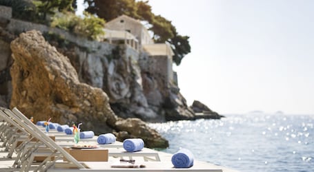 On the beach, sun loungers, beach umbrellas, beach towels