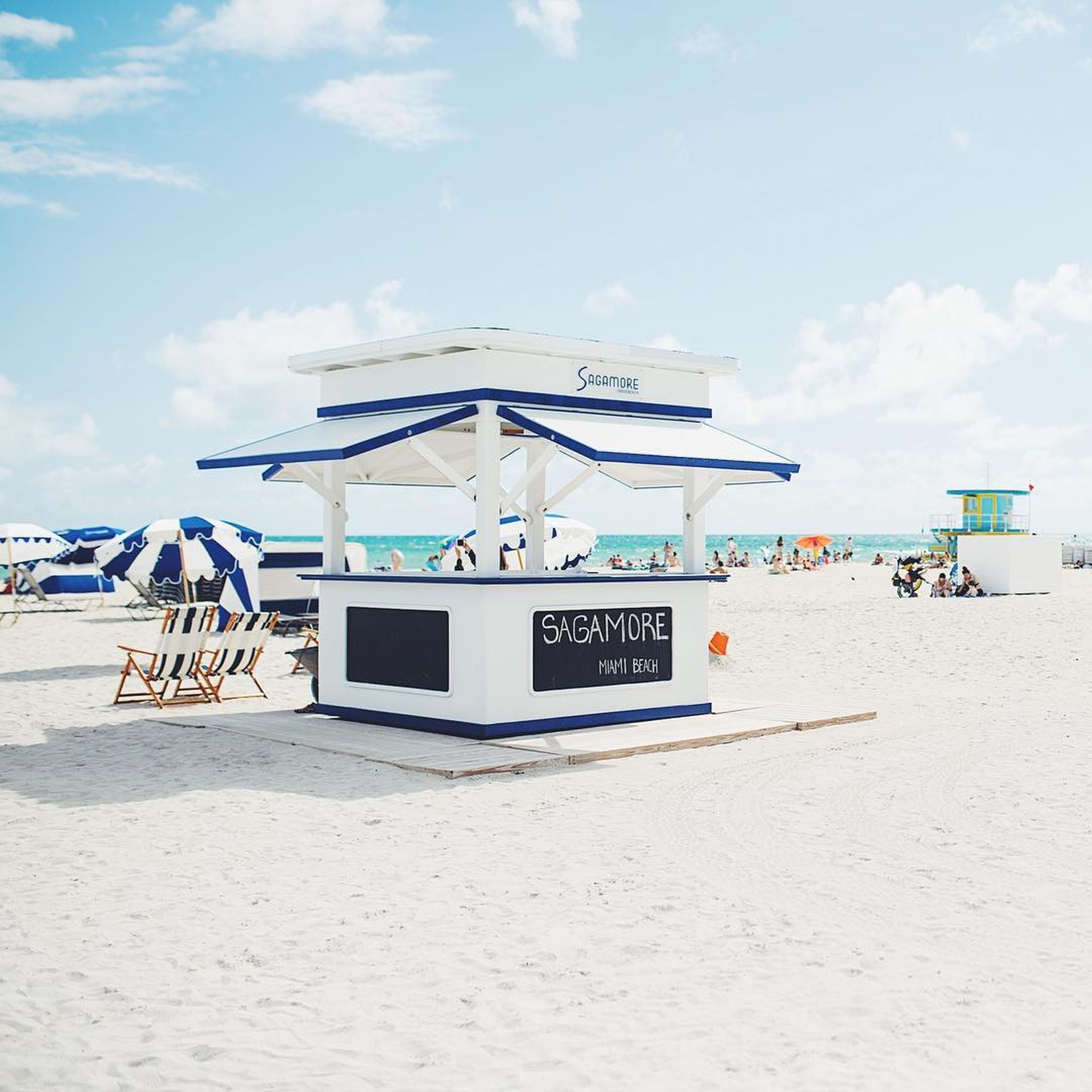 A beachside gazebo with the name "SAGAMORE Miami Beach" on it.