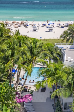 On the beach, white sand, beach umbrellas, beach towels