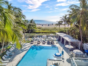 Outdoor pool, pool umbrellas, sun loungers