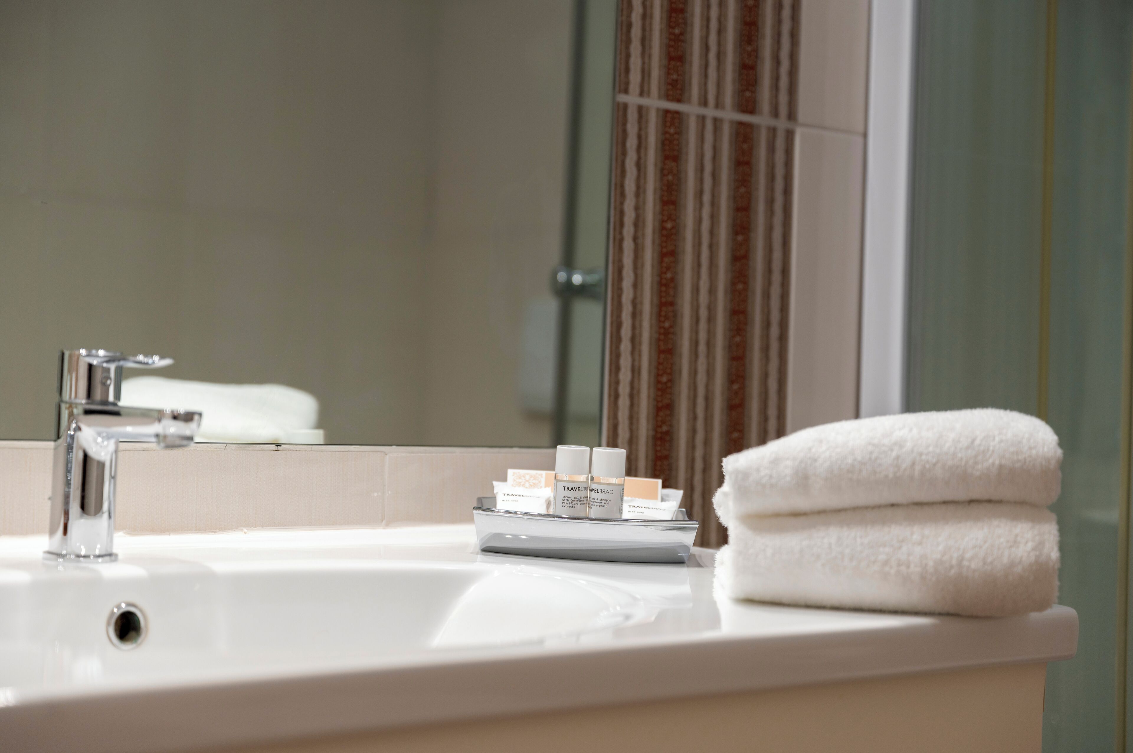junior suite | bathroom | shower, free toiletries, hair dryer, slippers