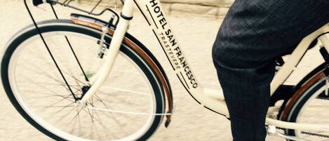 A close-up of a bicycle with the text "HOTEL SAN FRANCISCO" on the frame.