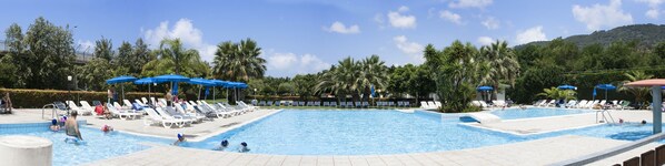 Outdoor pool, open 9:30 AM to 7:30 PM, pool umbrellas, pool loungers