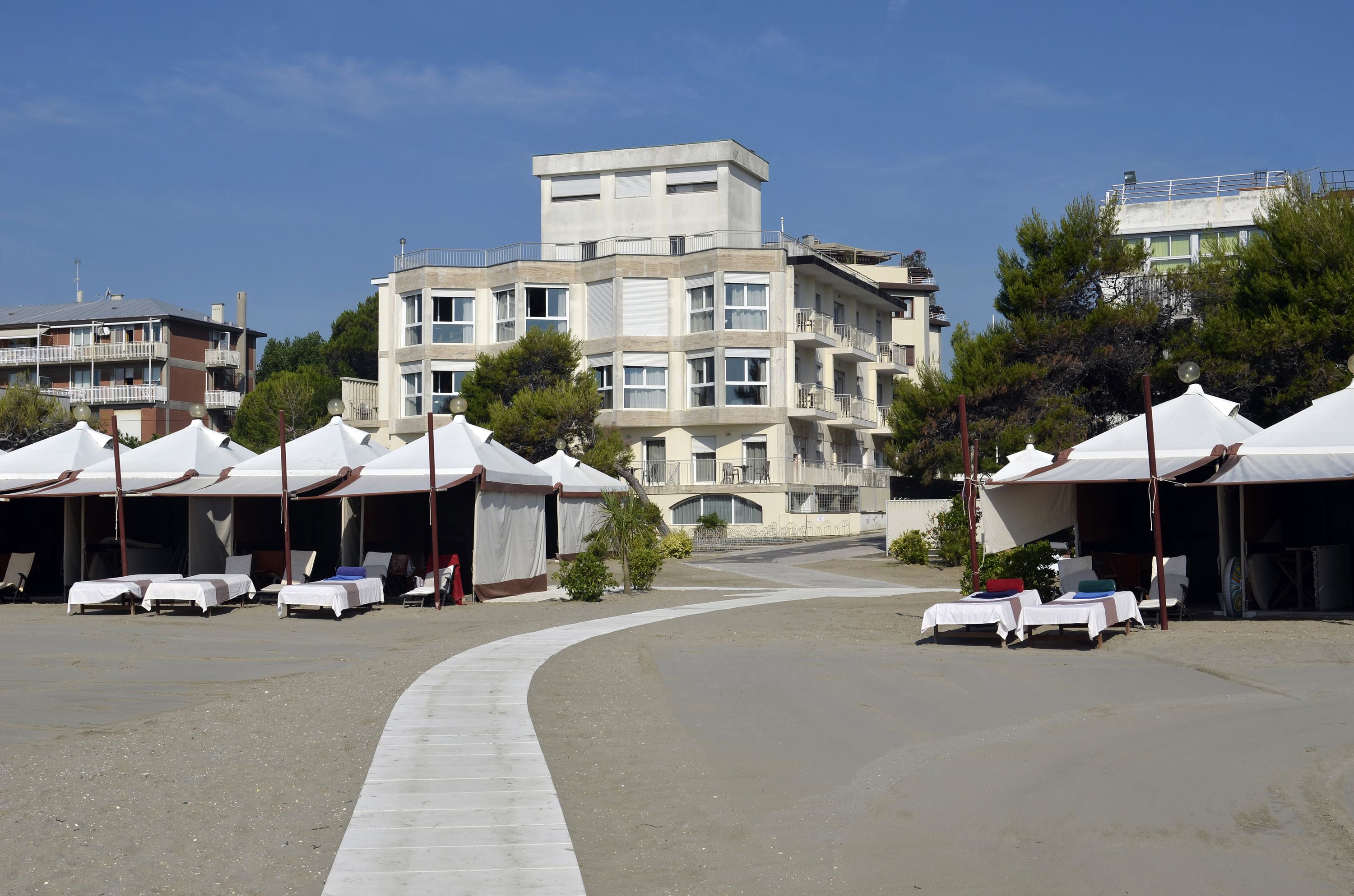 on the beach, beach cabanas, beach towels
