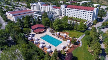 Seasonal outdoor pool, pool umbrellas, pool loungers