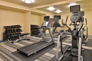 A hotel gym with treadmills, elliptical machines, and free weights. - Candlewood Suites Austin-Round Rock by IHG (Round Rock)