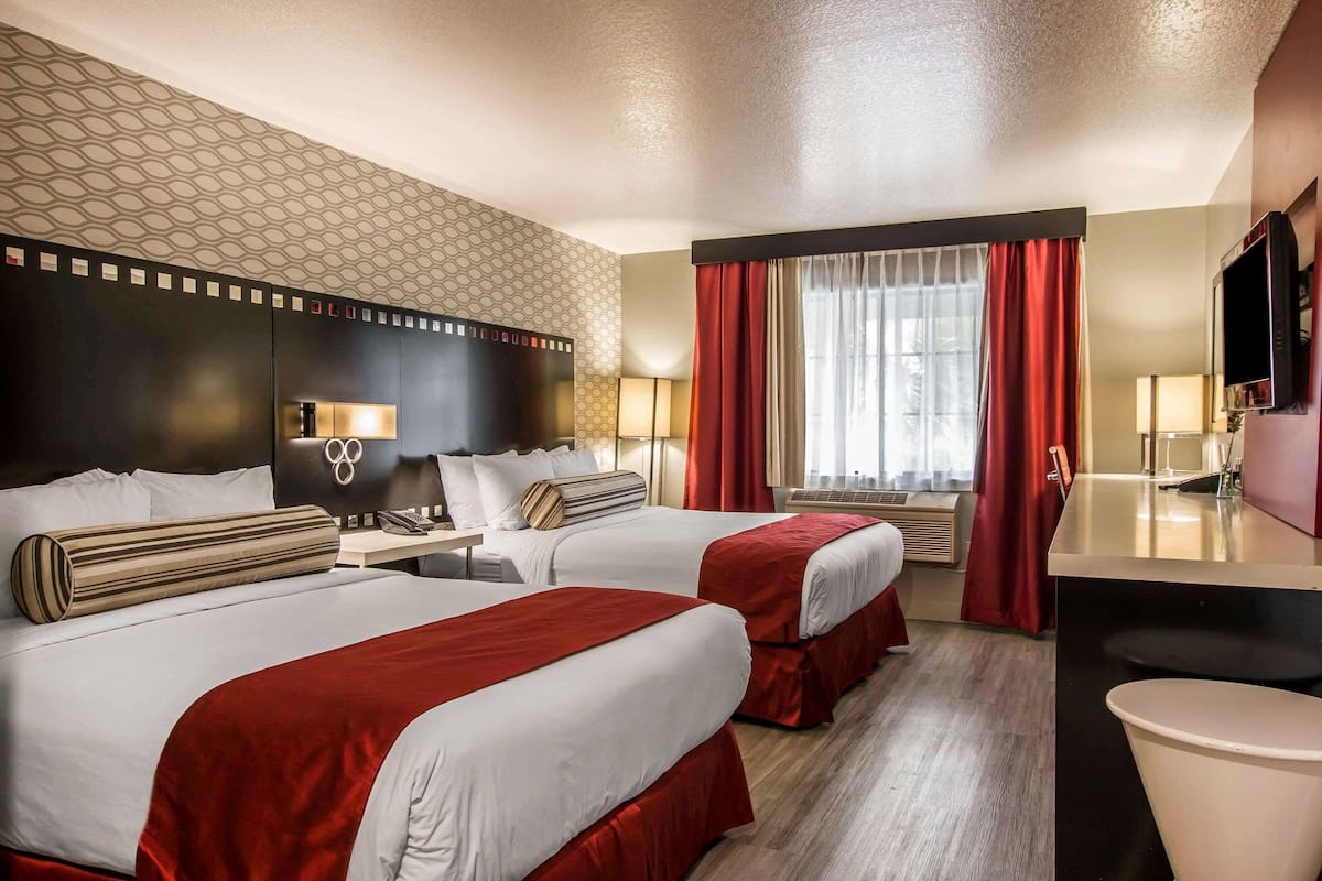 Family Suite, 1 King Bed and 2 Queen Beds, Non Smoking | 2 bedrooms, down comforters, desk, laptop workspace