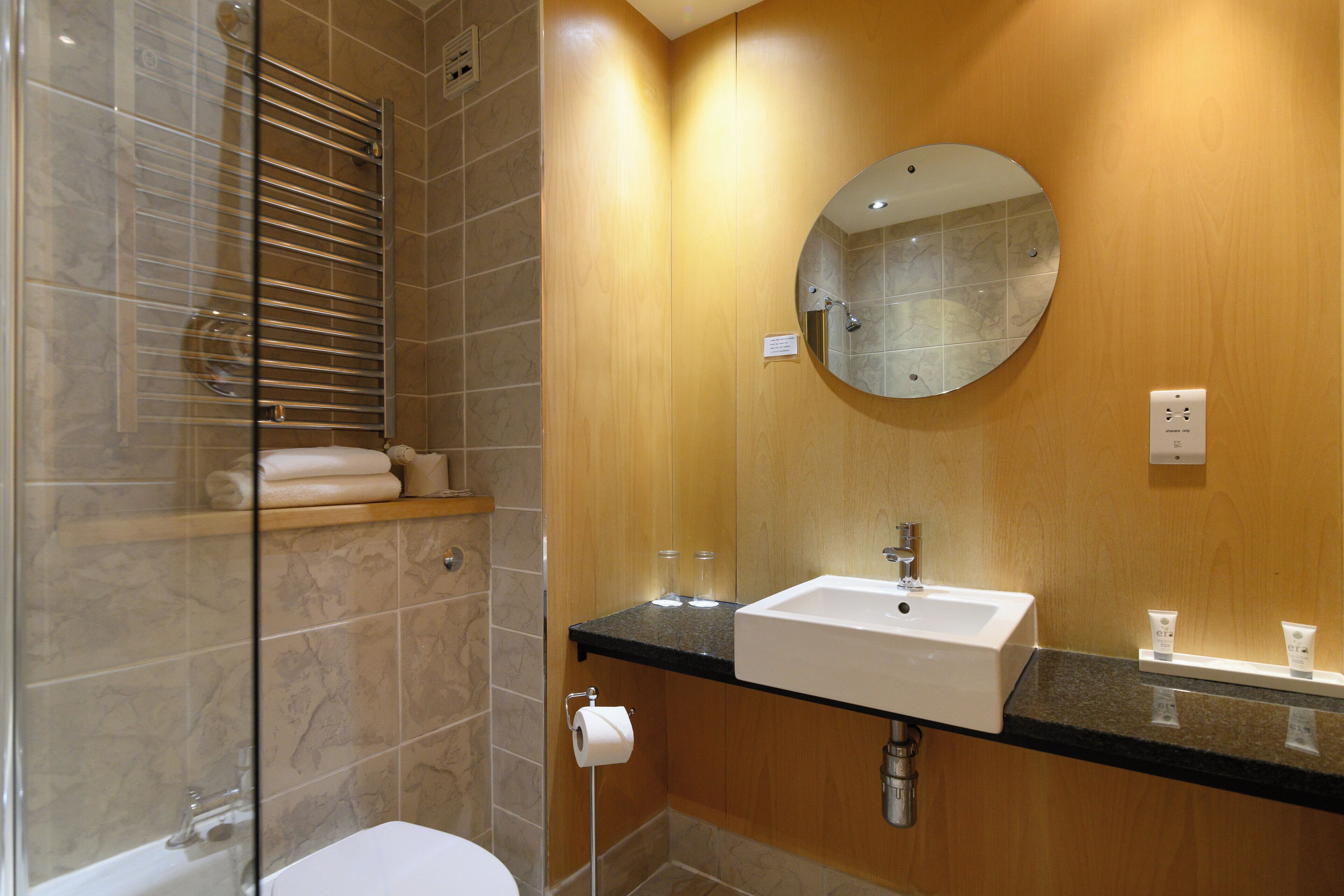 standard king | bathroom | designer toiletries, hair dryer, towels