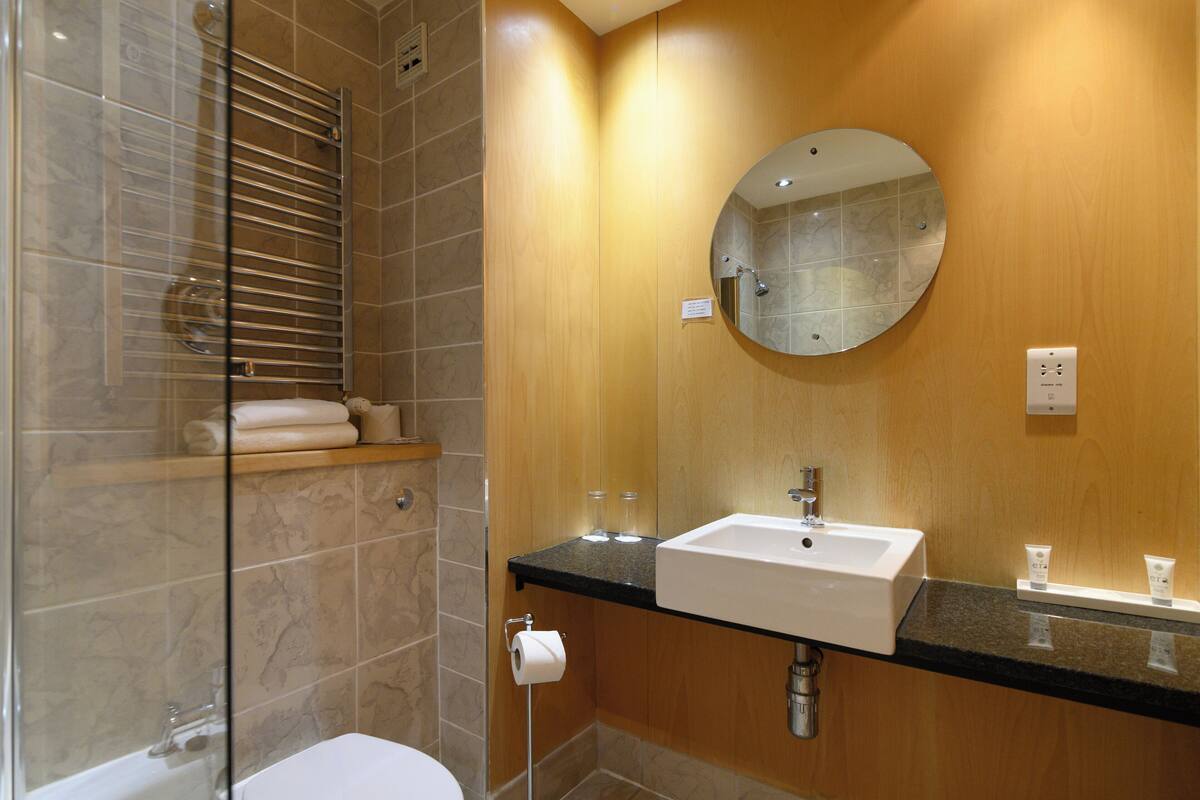 standard king | bathroom | designer toiletries, hair dryer, towels