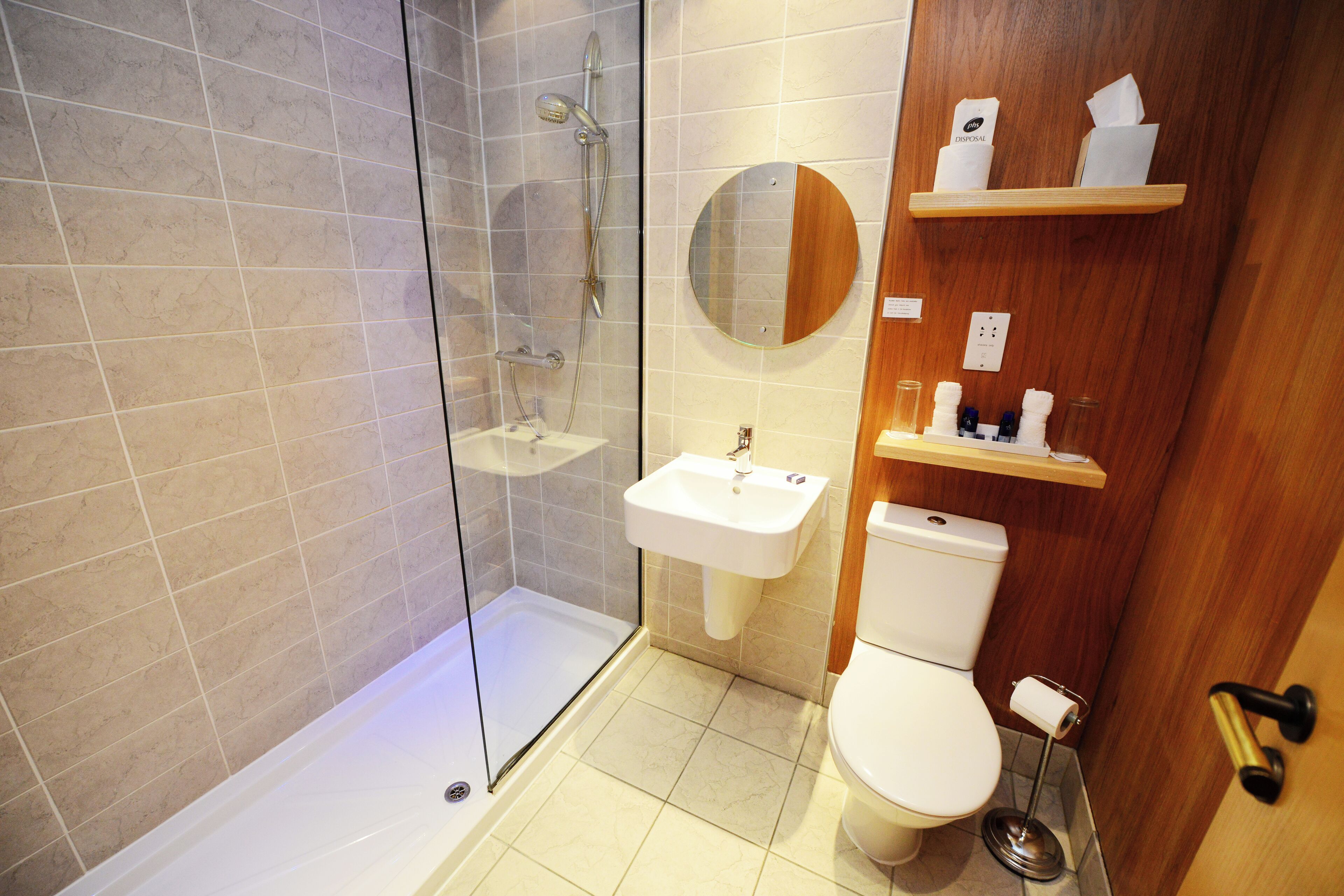 boutique twin | bathroom | designer toiletries, hair dryer, towels