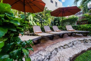 2 outdoor pools, open 8:00 AM to 11:00 PM, pool umbrellas, pool loungers