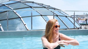 A person in a swimming pool with a glass ceiling structure in the background. - Gran Hotel Havana by Escampa Hotels (Barcelona)