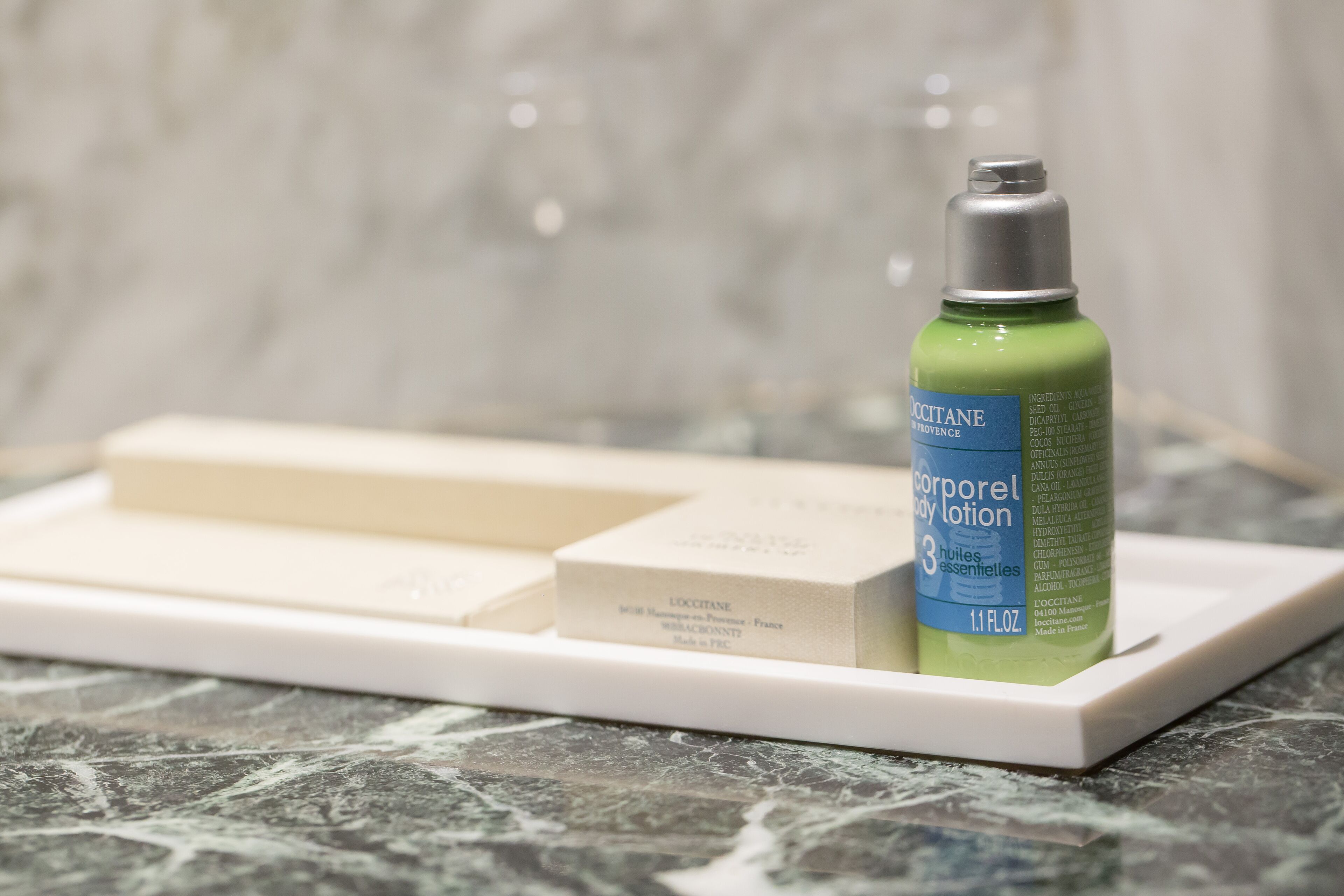 bathtub, designer toiletries, hair dryer, slippers