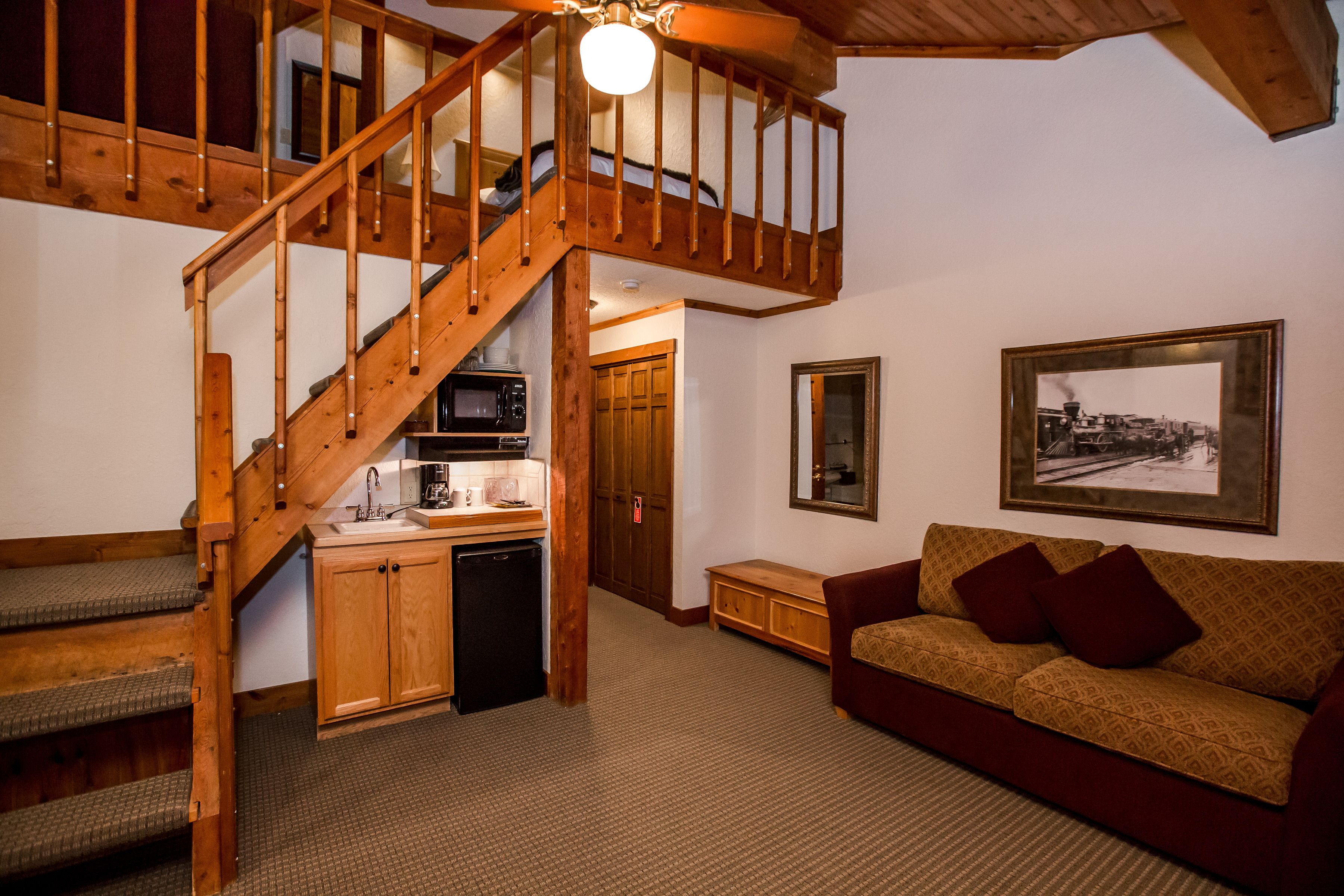 deluxe double room single use, refrigerator & microwave | living area | 50-inch flat-screen tv with cable channels, tv