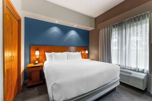 Suite, 1 King Bed, Non Smoking | Pillow-top beds, individually decorated, individually furnished, desk