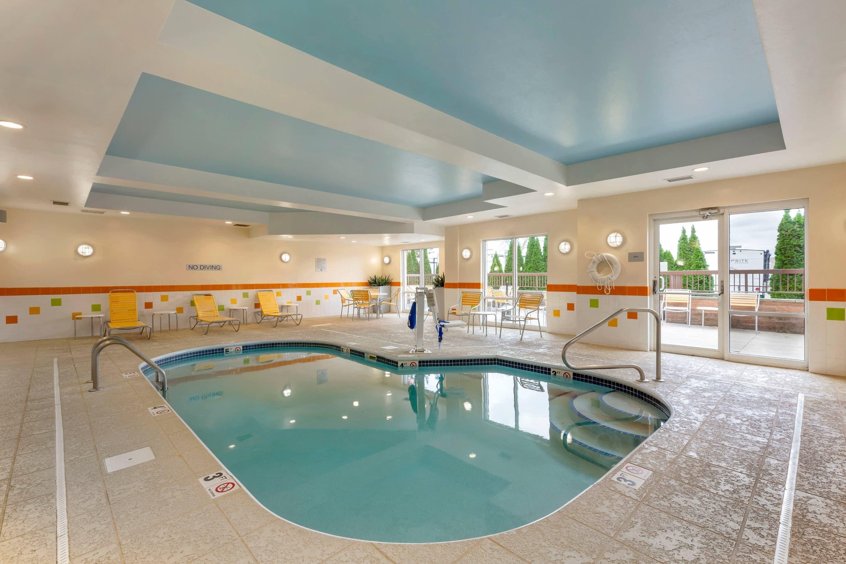 indoor pool, open 10:00 am to 9:00 pm, pool loungers