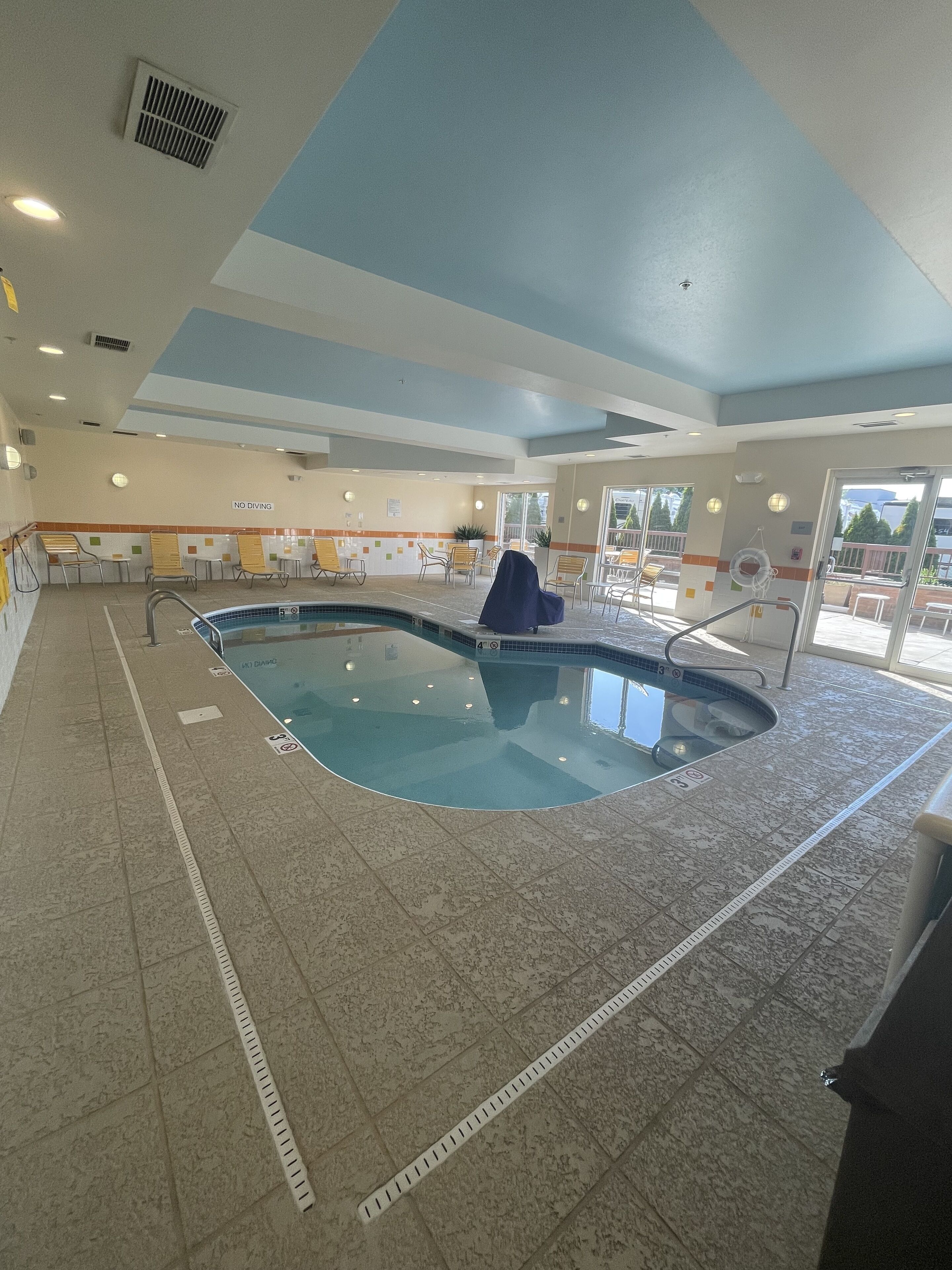 indoor pool, open 10:00 am to 9:00 pm, pool loungers