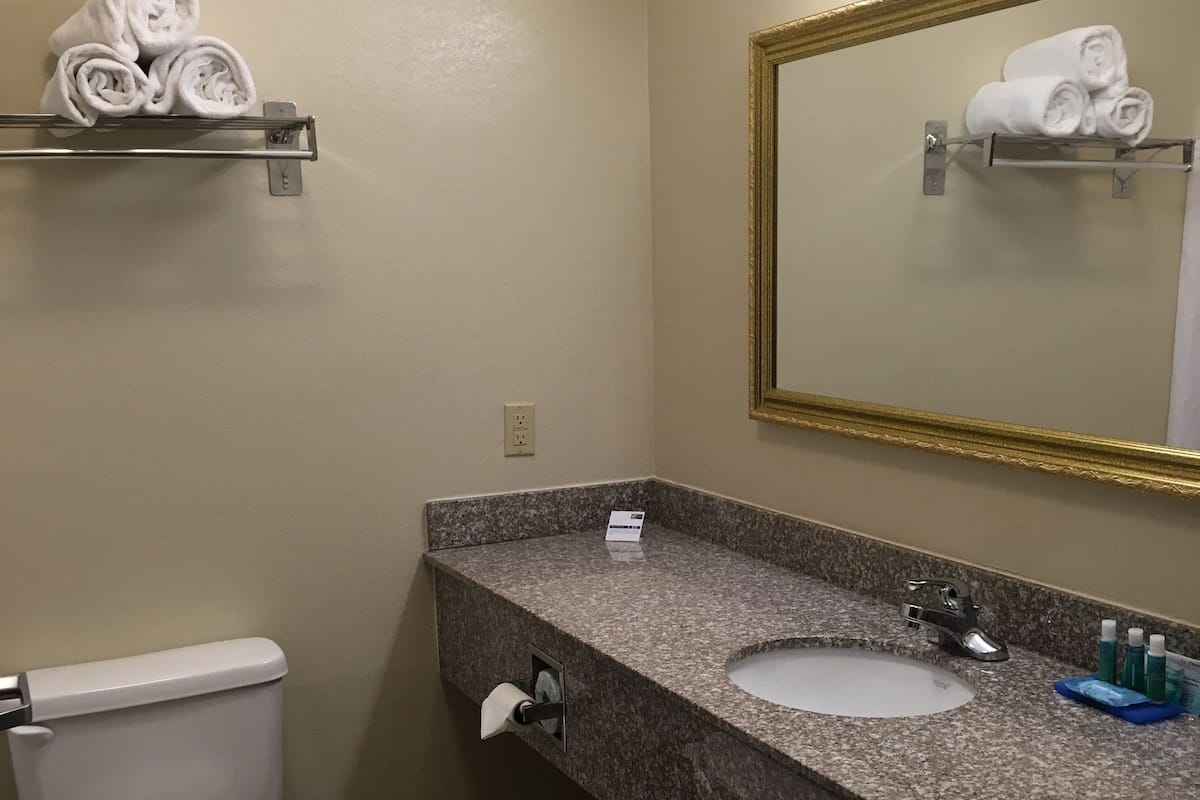 Standard Room, 2 Queen Beds | Bathroom | Combined shower/tub, free toiletries, hair dryer, towels