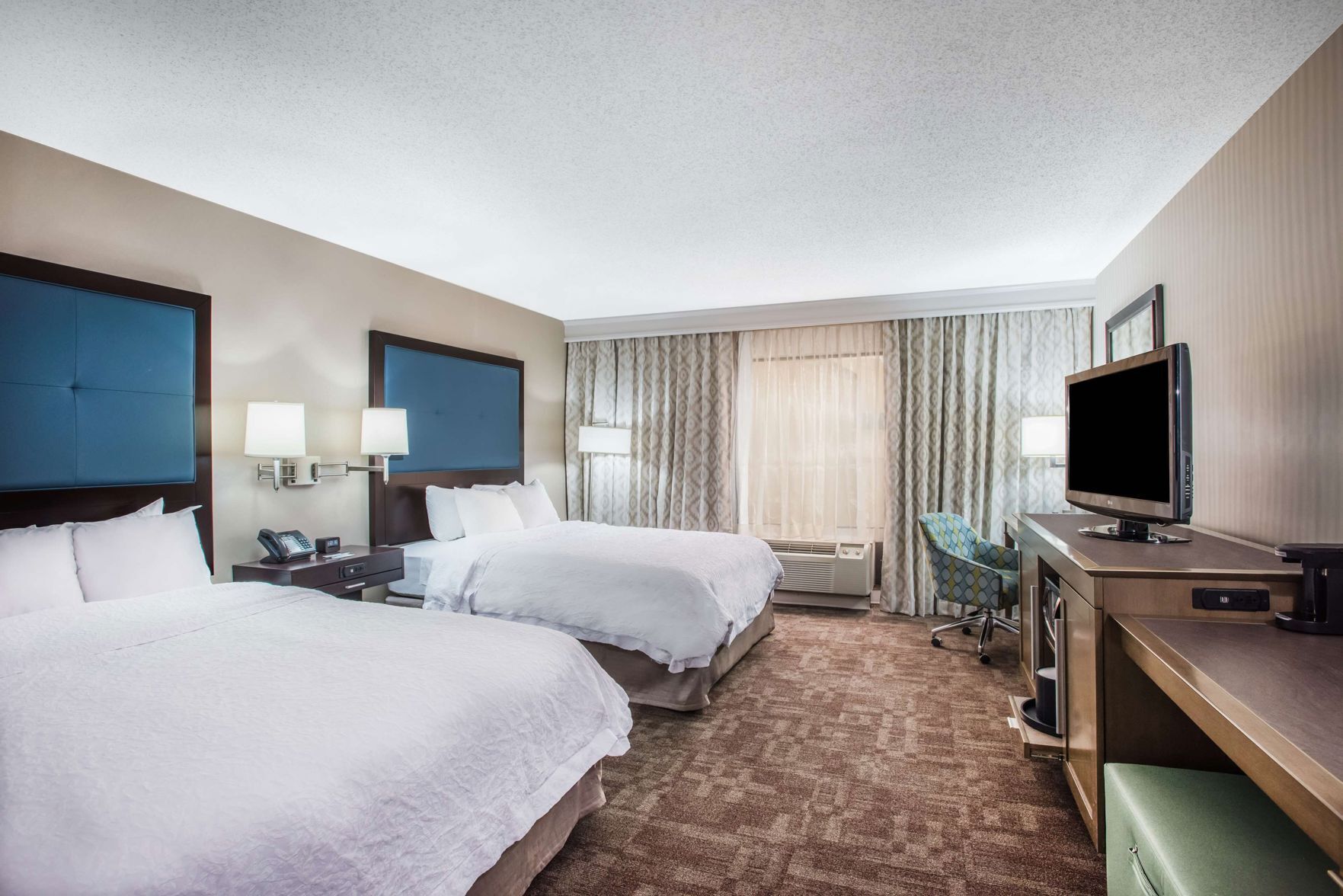 Desk, blackout drapes, iron/ironing board, rollaway beds