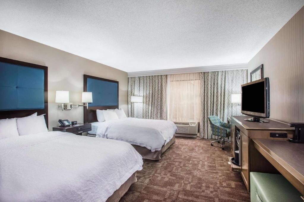 Desk, blackout drapes, iron/ironing board, rollaway beds