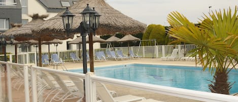 Outdoor pool, open 8:00 AM to 10:00 PM, sun loungers