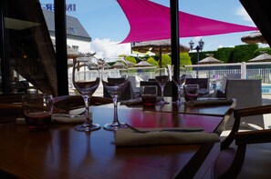 Lunch, dinner served; Regional cuisine, pool views 