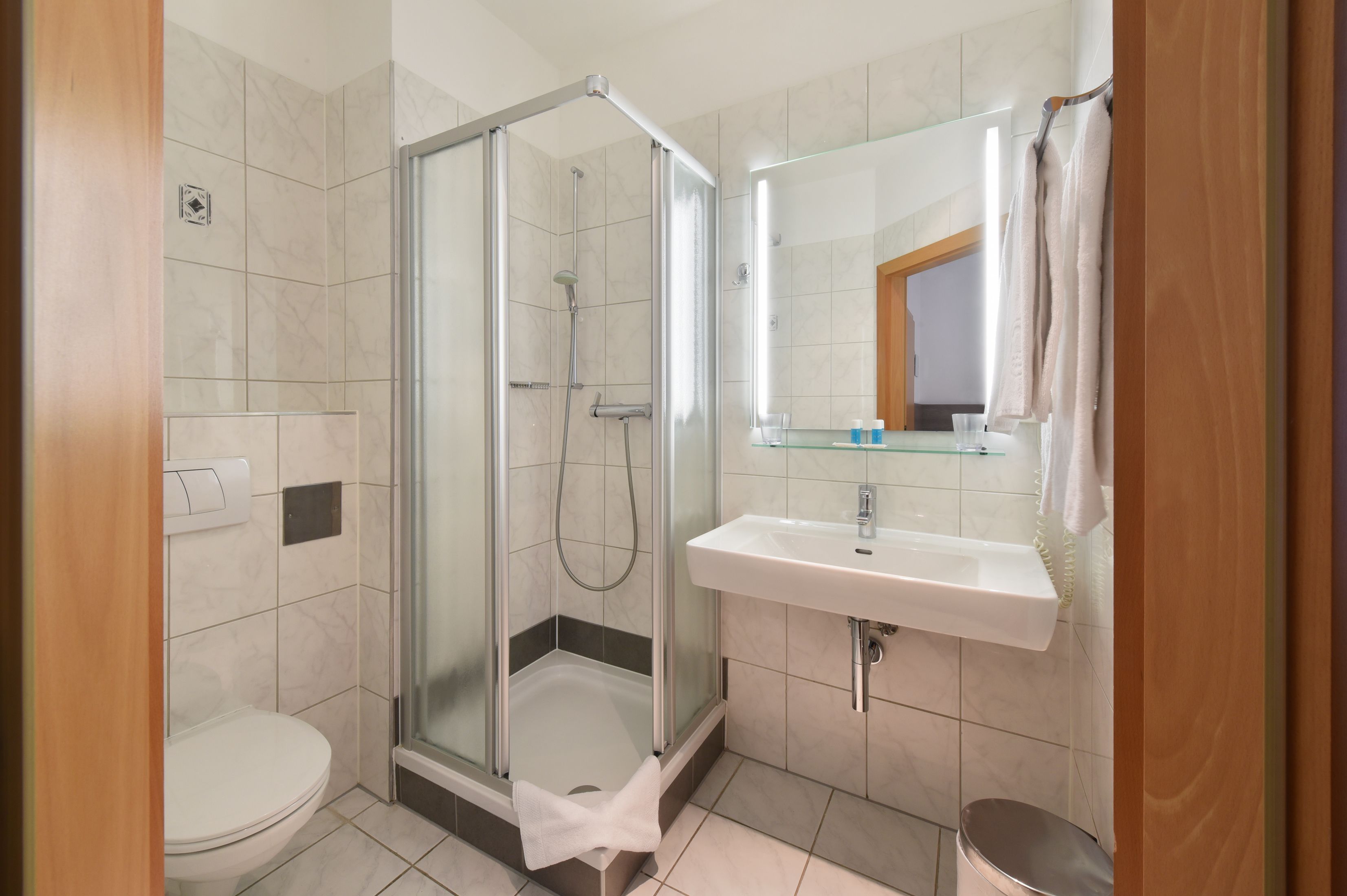 shower, free toiletries, hair dryer, towels