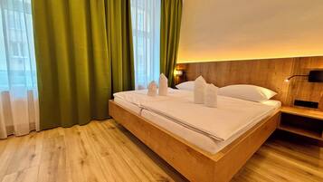 Apartamento superior | Roupas de cama premium, cofres nos quartos, individualmente decorados