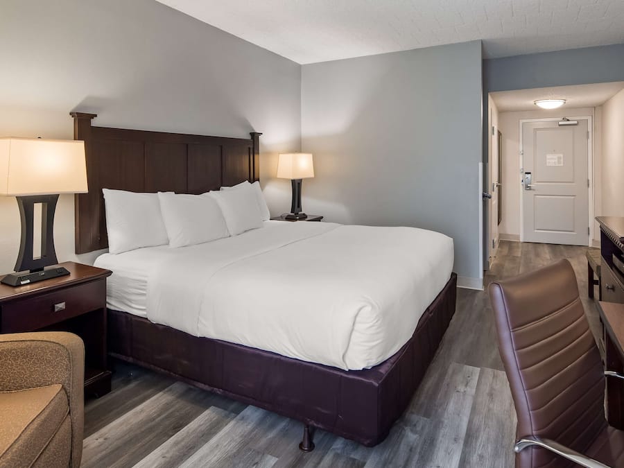 Premium bedding, desk, laptop workspace, blackout curtains