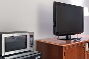 Tabla de planchar con plancha, wifi gratis y ropa de cama 