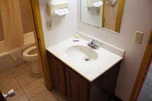 Separate tub and shower, rainfall showerhead, towels, soap