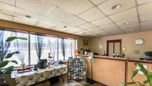 A reception area with a counter, a coffee machine, and a bulletin board. - Edyn Hotel By Townhouse Wytheville US 52 (Wytheville)