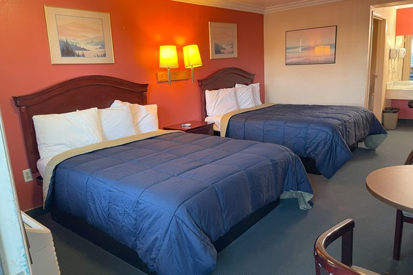 Room, 2 Queen Beds, Non Smoking | Iron/ironing board, free WiFi, bed sheets, alarm clocks