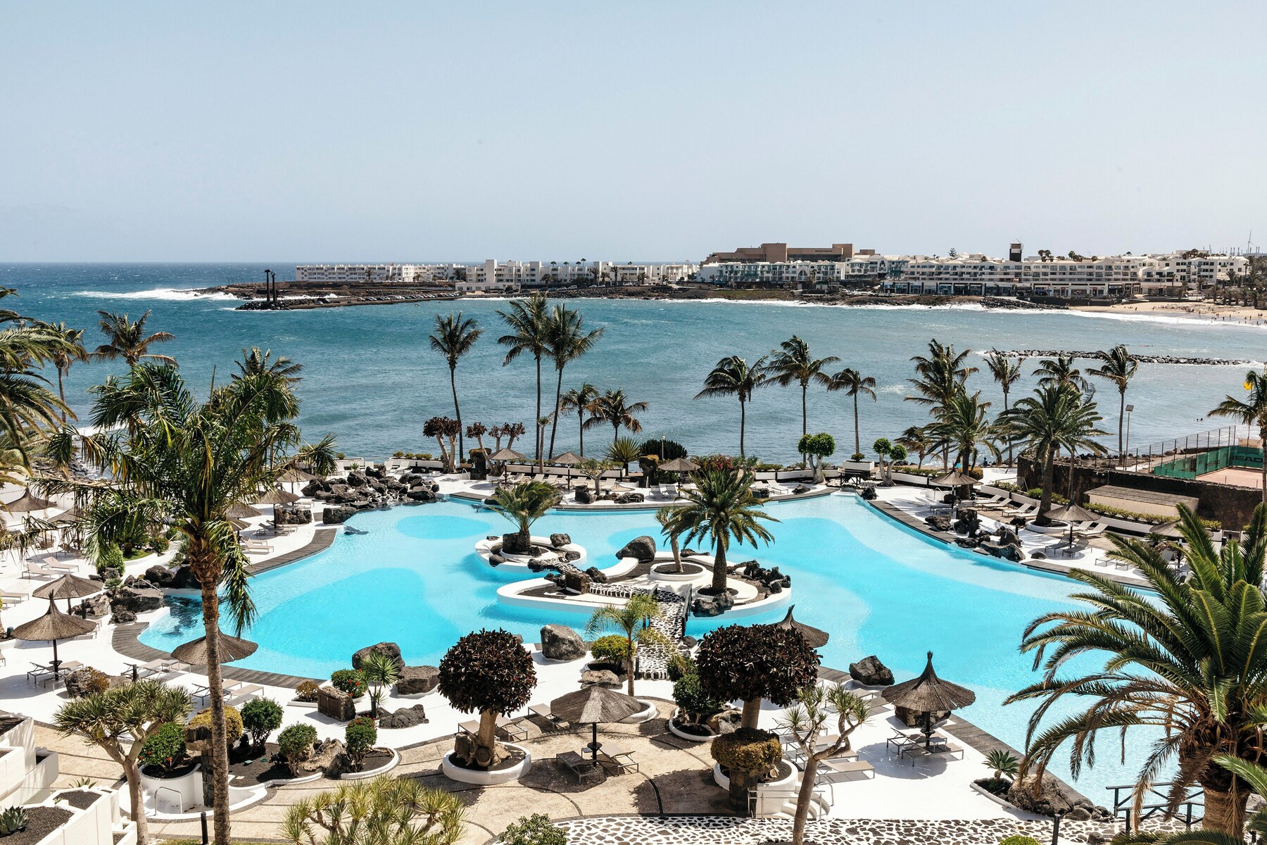 2 outdoor pools, pool umbrellas, pool loungers