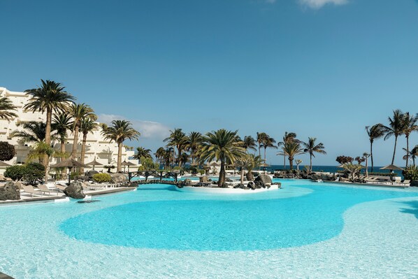 2 outdoor pools, pool umbrellas, pool loungers