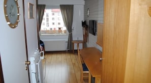 Desk, blackout drapes, soundproofing, iron/ironing board