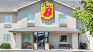 A Super 8 hotel with a prominent sign, large windows, and a covered entrance. - Super 8 by Wyndham Hagerstown/Halfway Area (Hagerstown)