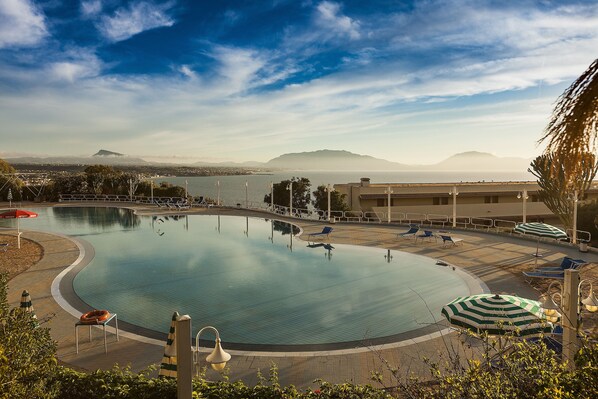 Seasonal outdoor pool, pool umbrellas, sun loungers