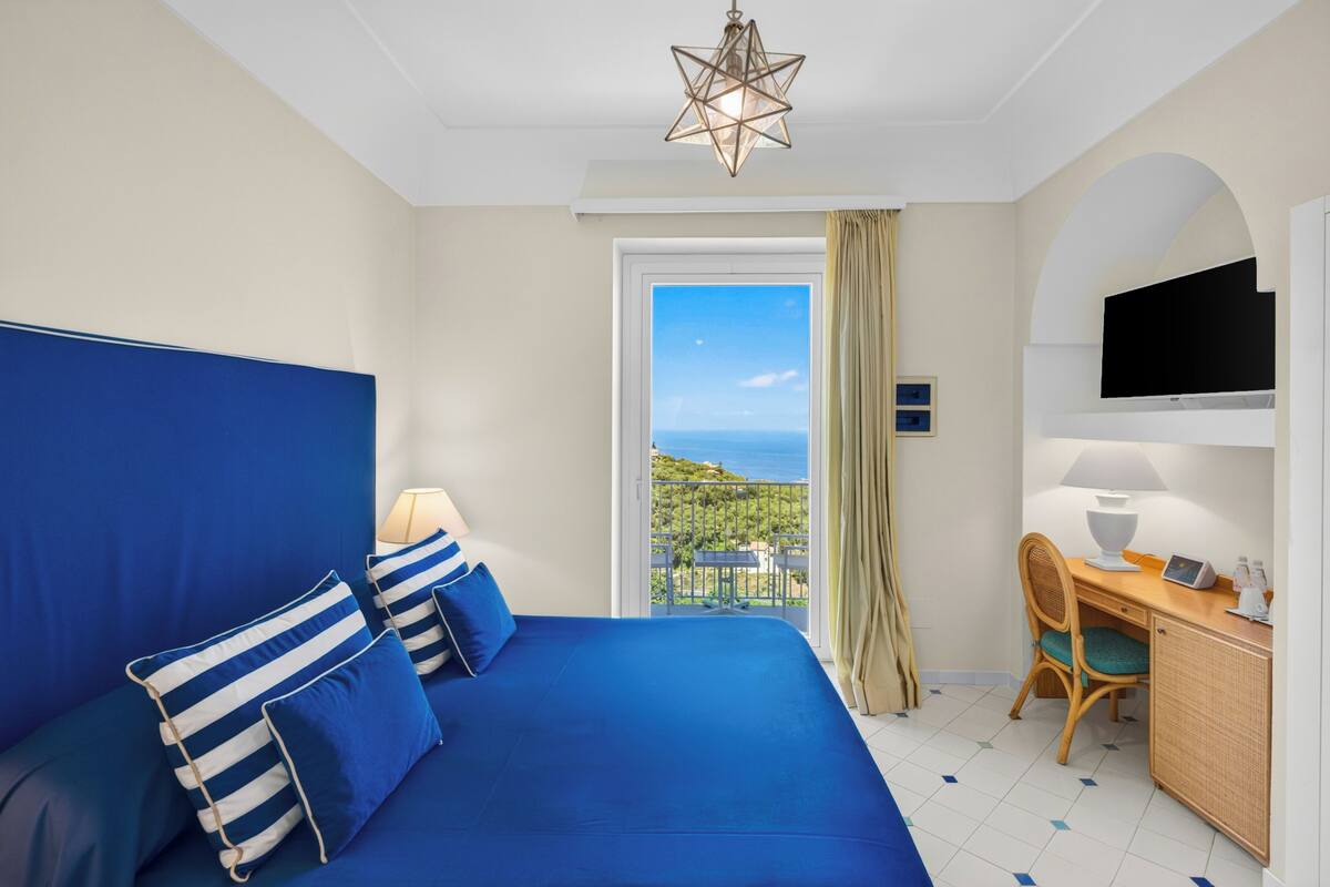 Superior Double Room, Balcony, Sea View (Sunset) | Pillowtop beds, minibar, in-room safe, desk