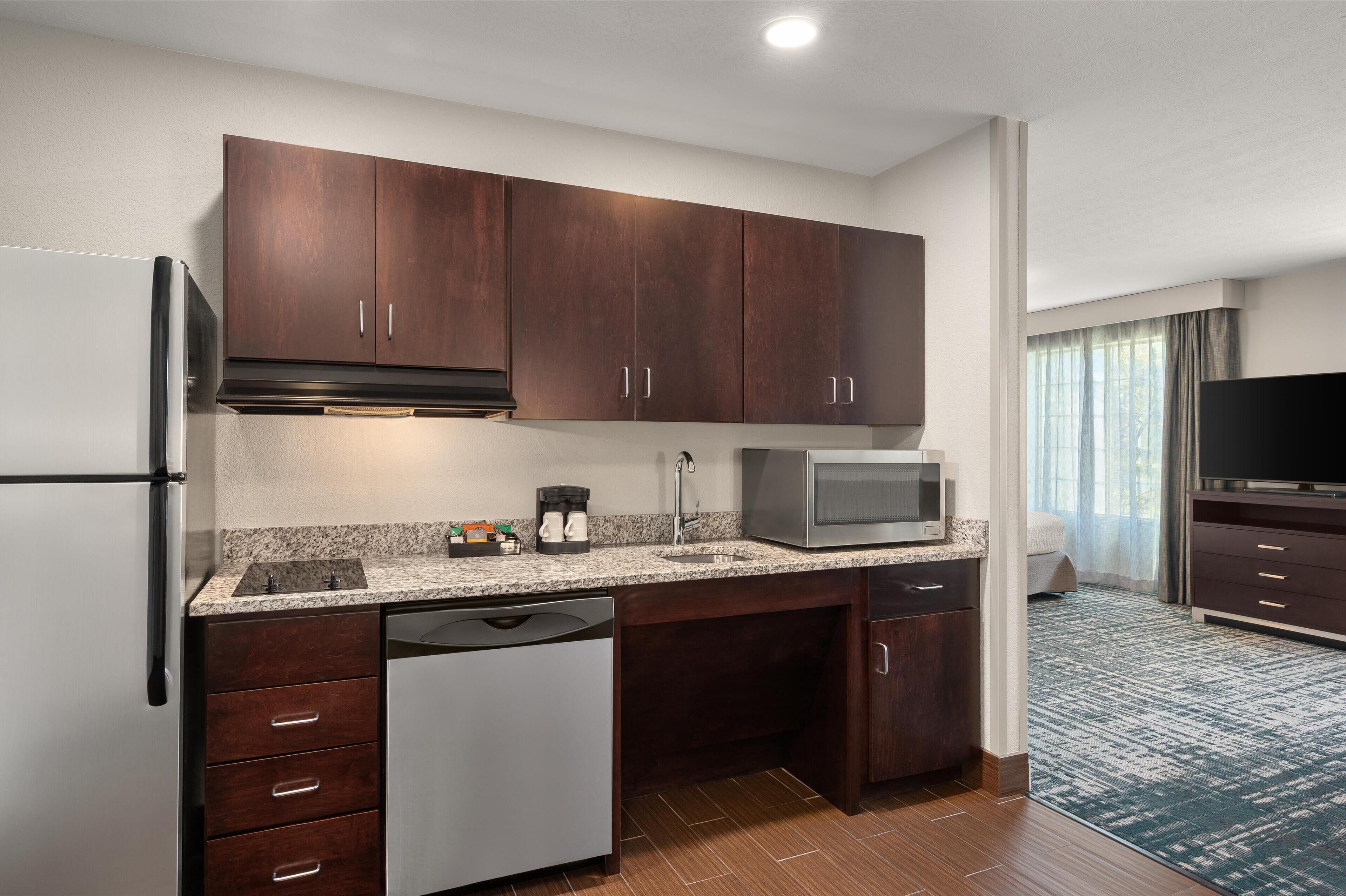 studio, 1 king bed, accessible, bathtub (mobility & hearing) | private kitchen | full-sized fridge, microwave, stovetop, dishwasher