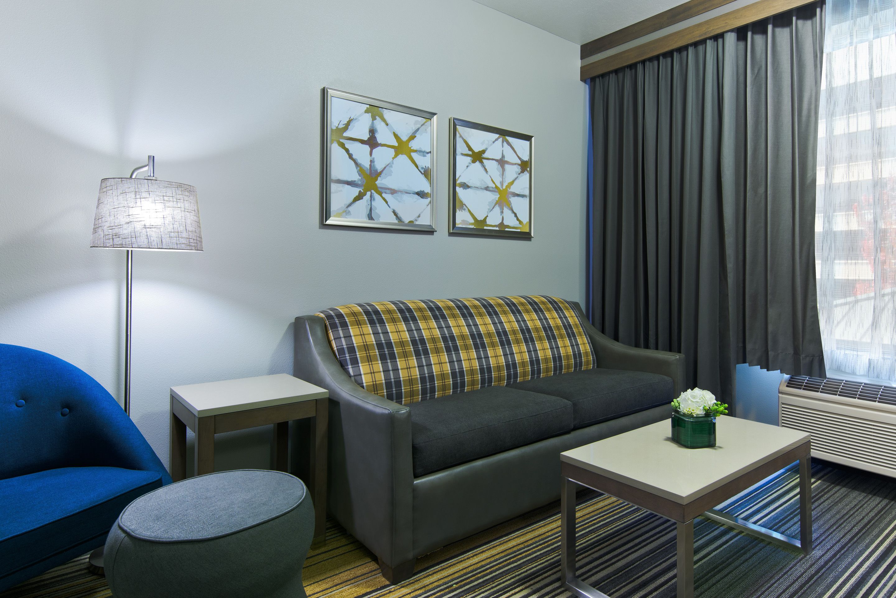 executive king suite sleeper sofa | living area | flat-screen tv