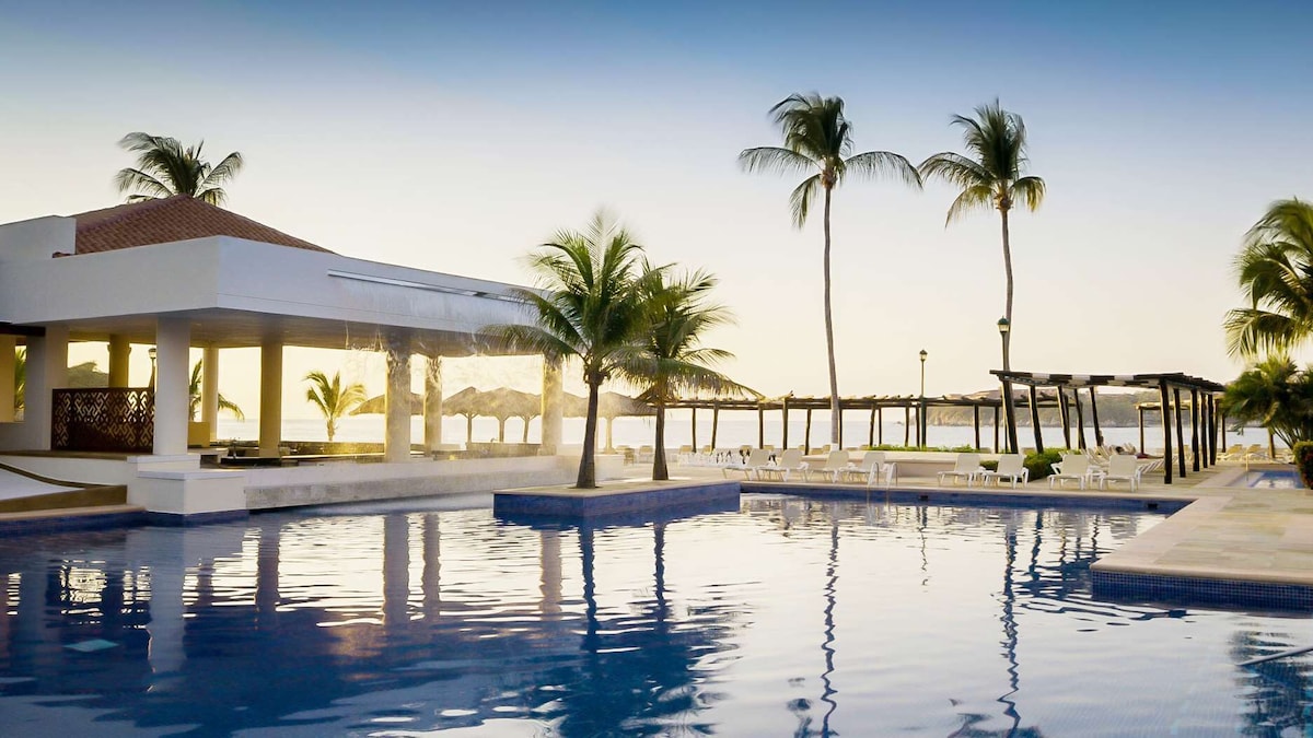 hotel pool at barcelo huatulco beach resort