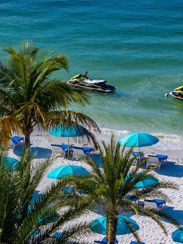 On the beach, white sand, beach towels, kayaking